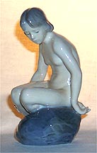 Royal Copenhagen Figurine - Girl On Stone