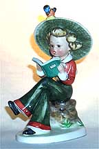 Girl Reading Book On Stump Nasha Figurine