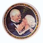 Golden Christmas collector plate by Norman Rockwell