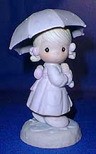 Enesco Precious Moments Figurine - April Girl