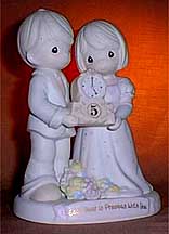 Enesco Precious Moments Figurine - Each Hour Is Precious With You