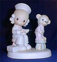 Enesco Precious Moments Figurine - Love Beareth All Things